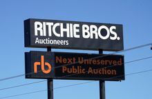 FILE PHOTO: The sign outside Richie Bros. Auctioneers is seen in Longmont, Colorado, U.S., February 21, 2017. REUTERS/Rick Wilking/File Photo