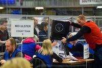 Electoral officers empty a ballot box to count ballots during the Northern Ireland Assembly Elections at the Meadowbank Sports Arena, in Magherafelt, Northern Ireland, May 6, 2022. REUTERS/Clodagh Kilcoyne