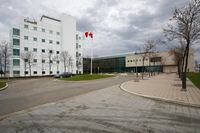 The National Microbiology Laboratory is shown in Winnipeg on May 19, 2009. The University of Manitoba has cut ties with a researcher who helped develop the Ebola vaccine while she is being investigated by the RCMP.A spokesperson says Dr. Xiangguo Qiu and her husband, Keding Cheng, have both had their non-salaried adjunct appointment at the university severed pending the investigation.THE CANADIAN PRESS/John Woods