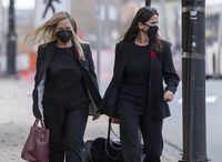 Tracy Kitch, left, the former chief executive of the IWK Health Centre, a children's hospital, walks outside provincial court with lawyer Jacqueline King during a break in Halifax on Monday, Nov. 8, 2021. THE CANADIAN PRESS/Andrew Vaughan