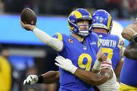 Los Angeles Rams' Matthew Stafford throws as he is hit during the first half of the NFC Championship NFL football game against the San Francisco 49ers Sunday, Jan. 30, 2022, in Inglewood, Calif. (AP Photo/Marcio Jose Sanchez) 