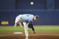 Tampa Bay Rays starting pitcher Drew Rasmussen throws in the first inning of a spring training baseball game against the Toronto Blue Jays in St. Petersburg, Fla., Sunday, March 19, 2023. (AP Photo/Gerald Herbert)