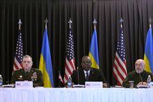 From left, German Defence Minister Boris Pistorius, U.S. Chairman of the Joint Chiefs of Staff Mark Milley, U.S. Defense Secretary Lloyd Austin, and Ukrainian Minister of Defense Oleksii Reznikov, attend the opening meeting of the 'Ukraine Defense Contact Group' at Ramstein Air Base in Ramstein, Germany, Friday, April 21, 2023. The U.S. will begin training Ukrainian forces how to use and maintain Abrams tanks in the coming weeks, as the U.S. continues to speed up its effort to get them onto the battlefield as quickly as possible, U.S. officials said Friday. (AP Photo/Matthias Schrader)