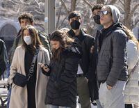 Tourists wear masks as they take in the sights on Tuesday, April 5, 2022 in Montreal. Quebec has announced it will be extending mandatory masking in indoor public places until the end of April. THE CANADIAN PRESS/Ryan Remiorz