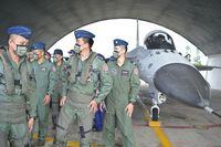 Taiwanese pilots walk pass an Indigenous Defense Fighter (IDF) at an air force base while Taiwan President Tsai Ing-wen (not pictured) inspects military troops on Penghu islands on August 30.
