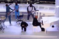 American Football  - NFL - Super Bowl LVI Halftime Show - Cincinnati Bengals v Los Angeles Rams - SoFi Stadium, Inglewood, California, United States - February 13, 2022  Eminem kneels besides Dr Dre as they perform together during the halftime show REUTERS/Mario Anzuoni