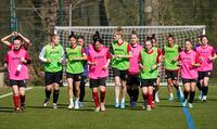 Players of women's soccer team of Ukrainian Football Club Kryvbas exercise at the training ground of Bundesliga soccer club 1.FC Cologne in Cologne, Germany, Wednesday, March 23, 2022. The players from Ukrainian women's professional soccer club Kryvbas have fled together from their home country following the invasion by Russia and are now living and training in Germany with the support of Bundesliga club Cologne. (AP Photo/Martin Meissner)