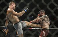 Marc-Andre Barriault is kicked by Krzysztof Jotko during UFC 240, in Edmonton on Saturday, July 27, 2019. American Chidi (Chidi Bang Bang) Njokuani knocked out Quebec middleweight Marc-Andre (Powerbar) Barriault in just 16 seconds on the undercard of a UFC Fight Night card Saturday. THE CANADIAN PRESS/Jason Franson