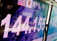 Employees of the foreign exchange trading company Gaitame.com are reflected on monitors displaying the Japanese yen exchange rate against the U.S. dollar at its dealing room in Tokyo, Japan Sept. 7.