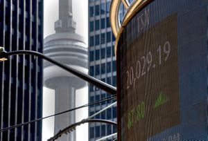 A signboard displays the TSX close in Toronto on Friday, June 4, 2021. THE CANADIAN PRESS/Frank Gunn