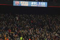 A screen displaying the attendance number of spectators during the Women's Champions League quarter final, second leg soccer match between Barcelona and Real Madrid at Camp Nou stadium in Barcelona, Spain, Wednesday, March 30, 2022. A world-record crowd for a women's soccer match of more than 91,000 people watched Barcelona defeat Real Madrid 5-2 in the Champions League at the Camp Nou Stadium. (AP Photo/Joan Monfort)