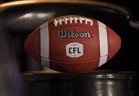 A football with the CFL logo sits on a chair in Winnipeg, Friday, November 27, 2015. THE CANADIAN PRESS/John Woods