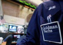 FILE PHOTO: A trader works at the Goldman Sachs stall on the floor of the New York Stock Exchange, April 16, 2012.  REUTERS/Brendan McDermid (UNITED STATES - Tags: BUSINESS)/File Photo