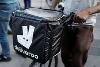 FILE PHOTO: A biker, wearing a Deliveroo food courier backpack, demonstrates during a call on clients to boycott the brand in Paris, France, August 7, 2019.  REUTERS/Charles Platiau/File Photo