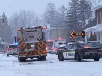 Police and fire officials block off a road as municipal officials say workers are missing after an explosion at a propane facility in St-Roch-de-l'Achigan, Que., north of Montreal on Thursday, Jan.12, 2023.&nbsp;A man who witnessed the explosion at a Quebec propane distribution company north of Montreal rushed to the site and attempted to save a woman in distress.THE&nbsp;CANADIAN PRESS/Ryan Remiorz