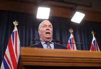 B.C. Premier John Horgan answers questions during a news conference in the press theatre at the legislature in Victoria, Friday, March 11, 2022. THE CANADIAN PRESS/Chad Hipolito