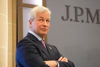 FILE - JP Morgan CEO Jamie Dimon looks on during the inauguration the new French headquarters of JP Morgan bank Tuesday, June 29, 2021 in Paris.  Dimon said Friday, Nov. 24,  that “he truly regrets” a quip he made this week about JPMorgan outlasting the Chinese Communist Party. Dimon was speaking at an event in Boston where he noted that both his bank and the Communist Party were celebrating their 100th birthdays.   (AP Photo/Michel Euler, Pool, File)