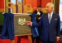 FILE PHOTO: Britain's King Charles unveils a plaque that commemorates his visit at the Royal Courts of Justice in London, Britain, December 14, 2023. REUTERS/Hannah McKay/Pool/File Photo