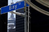The Bay Street financial district is shown next to the CN Tower in Toronto on Friday, August 5.