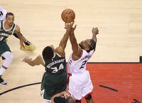 May 19, 2019; Toronto, Ontario, CAN; Milwaukee Bucks forward Giannis Antetokounmpo (34) tips off in overtime against Toronto Raptors forward Kawhi Leonard (2) in game three of the Eastern conference finals of the 2019 NBA Playoffs at Scotiabank Arena. The Raptors beat the Bucks 118-112 in the second overtime. Mandatory Credit: Tom Szczerbowski-USA TODAY Sports