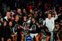 The Las Vegas Aces celebrate with the trophy after Game 4 of a WNBA basketball final playoff series against the New York Liberty Wednesday, Oct. 18, 2023, in New York. The Aces won 70-69. (AP Photo/Frank Franklin II)