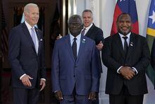 FILE - President Joe Biden poses for photos with Pacific Island leaders including Solomon Islands Prime Minister Manasseh Sogavare, center, and Papua New Guinea Prime Minister James Marape on the North Portico of the White House in Washington, Sept. 29, 2022. On Wednesday, May 17, Biden canceled a visit to Papua New Guinea planned for May 22 to focus on debt limit talks at home, disappointing many in the Pacific Island nation. (AP Photo/Susan Walsh, File)
