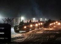 In this photo provided by Vayar Military Agency on Tuesday, Jan. 25, 2022, Belarusian military vehicles gather preparing to attend Belarusian and Russian joint military drills in Belarus. Russia has sent an unspecified number of troops from the country's far east to its ally Belarus, which shares a border with Ukraine, for major war games next month. (Vayar Military Agency Agency via AP)