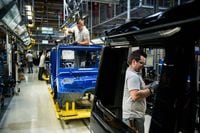 Workers assemble Mercedes-Benz AG G-Class automobiles on the production line at the Magna International Inc. plant in Graz, Austria, on Thursday, Dec. 3. 2015.