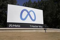 FILE - Facebook's Meta logo sign is seen at the company headquarters in Menlo Park, Calif., on, Oct. 28, 2021. Facebook owner Meta is quietly curtailing some of the safeguards designed to thwart voting misinformation or foreign interference in elections even as the U.S. Midterms approach. (AP Photo/Tony Avelar, File)