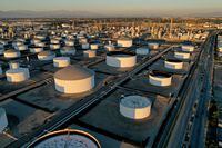 FILE PHOTO: Storage tanks are seen at Marathon Petroleum's Los Angeles Refinery, which processes domestic & imported crude oil, in Carson, California, U.S., March 11, 2022. Picture taken with a drone. REUTERS/Bing Guan/File Photo