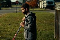 ***USE ONLY IN ORIGINAL STORY***Neil Doef photographed outside his family home in Smiths Falls Ontario. A few blocks away from where he attended High School. Pictured here with the stick he played with during his last game with Team Canada. Nov 2, 2022.