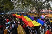 Members of the LGBTQ community and their supporters carry a rainbow flag as they march demanding equal marriage rights in New Delhi, India, Sunday, Jan.8 2023. The government is yet to legalize same-sex marriages in the country even though the Supreme Court in 2018 struck down a colonial-era law that made gay sex punishable by up to 10 years in prison. (AP Photo)