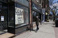 A hand painted sign about the Canada Emergency Business Account, is seen in front window of Frances Watson, a store on Queen St. West, on April 15 2020. Some businesses were happy to hear about the CEBA, but now find some of the requirements to hard to meet.