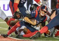 Montreal Alouettes quarterback Trevor Harris (7) is sacked by the Ottawa Redblacks during second half CFL football action in Montreal, Friday, Sept. 2, 2022. THE CANADIAN PRESS/Graham Hughes