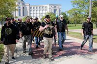 Armed members of the 'Proud Boys' leave after attending a '2nd Amendment' rally outside the Michigan Supreme Court Building in Lansing, Michigan, U.S. September 17, 2020. REUTERS/Rebecca Cook