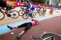 Alison Jackson of Canada celebrates moment after she crosses the finish line to win the women's Paris Roubaix, a 145 kilometer (90 miles) one-day-race, at the velodrome in Roubaix, northern France, Saturday, April. 8, 2023. (Tim De Waele, Pool via AP)