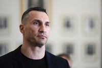 FILE - Former heavyweight boxing world champion Wladimir Klitschko leaves after a meeting with German Economy and Climate Minister Robert Habeck in Berlin, March 31, 2022. Olympic gold medalist Wladimir Klitschko has joined Ukraine’s fight against IOC plans to let some Russians compete at the 2024 Paris Summer Games, it was announced Tuesday, Jan. 31, 2023. The former heavyweight world champion has suggested in a video message sports leaders will be accomplices to the war if athletes from Russia and its military ally Belarus can compete at the next Olympics.  (AP Photo/Markus Schreiber, file)