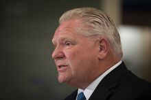 Ontario Premier Doug Ford answers questions following a  press conference at a Shoppers Drug Mart pharmacy in Etobicoke, Ont., on Wednesday, January 11, 2023.  THE CANADIAN PRESS/ Tijana Martin