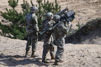 Staff Sgt. Edward Greene, Sgt. Christopher Bazan, and Spc. Jack Ovando, assigned to the 3rd Battalion, 265th Air Defense Artillery Regiment, supporting the 4th Infantry Division, conduct air threat engagement tactics with man-portable air-defense systems (MANPADS) during an exercise at Adazi, Latvia, on April 29, 2023. The U.S. is set to announce $345 million in military aid for Taiwan, two U.S. officials said Friday, July 28. The package includes MANPADS, intelligence and surveillance capabilities, firearms and missiles, according to the officials, who spoke on the condition of anonymity to discuss sensitive matters ahead of the announcement. (Staff Sgt. Cesar Rivas/U.S. Army via AP)