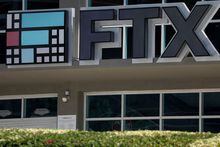 FILE PHOTO: The logo of FTX is seen at the entrance of the FTX Arena in Miami, Florida, U.S., November 12, 2022. REUTERS/Marco Bello