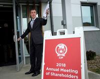 CP Rail president and CEO Keith Creel holds the door for shareholders at the company's annual meeting in Calgary, Thursday, May 10, 2018.THE CANADIAN PRESS/Jeff McIntosh