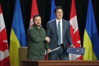 Canadian Prime Minister Justin Trudeau (R) and Ukraine's President Volodymyr Zelensky shake hands after signing a modernization of the Canada-Ukraine Free Trade Agreement on Parliament Hill on September 22, 2023 in Ottawa. (Photo by Dave Chan / AFP) (Photo by DAVE CHAN/AFP via Getty Images)