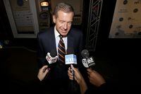FILE - In this Thursday, Nov. 13, 2014, file photo, television journalist Brian Williams arrives at the Asbury Park Convention Hall during red carpet arrivals prior to the New Jersey Hall of Fame inductions, in Asbury Park, N.J. Williams says he's leaving NBC News when his contract ends in December 2021. (AP Photo/Julio Cortez, File)