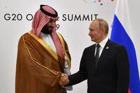 Russia's President Vladimir Putin shakes hands with Saudi Arabia's Crown Prince Mohammed bin Salman during a meeting on the sidelines of the G20 Summit in Osaka, Japan June 29, 2019. Yuri Kadobnov/Pool via REUTERS