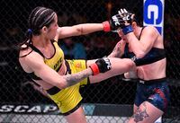 LAS VEGAS, NEVADA - FEBRUARY 13: In this handout image provided by UFC, (L-R) Polyana Viana of Brazil kicks Mallory Martin in their strawweight fight during the UFC 258 event at UFC APEX on February 13, 2021 in Las Vegas, Nevada. (Photo by Jeff Bottari/Zuffa LLC via Getty Images)