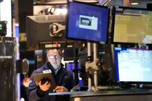 Traders work on the floor at the New York Stock Exchange in New York, Tuesday, Jan. 24, 2023. (AP Photo/Seth Wenig)