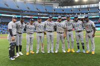 Sep 15, 2022; Toronto, Ontario, CAN;  Tampa Bay Rays players of Latin American descent pose for a group photo after defeating Toronto Blue Jays 11-0 at Rogers Centre. The Rays fielded the first ever starting team of Latin American descent. From left are catcher Rene Pinto (50), third baseman Yandy Diaz (2), shortstop Wander Franco (5) second baseman Isaac Paredes (17), left fielder David Peralta (6), first baseman Harold Ramirez (43), center fielder Jose Siri (22), designated hitter Manuel Margot (13) and right fielder Randy Arozarena (56).  Mandatory Credit: Dan Hamilton-USA TODAY Sports