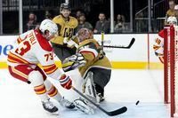Calgary Flames right wing Tyler Toffoli scores on Vegas Golden Knights goaltender Jonathan Quick during the third period of an NHL hockey game Thursday, March 16, 2023, in Las Vegas. (AP Photo/Ellen Schmidt)