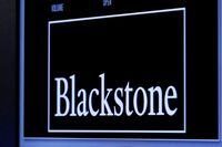 FILE PHOTO -  The logo of Blackstone Group is displayed at the post where it is traded on the floor of the New York Stock Exchange (NYSE) April 4, 2016. REUTERS/Brendan McDermid/File Photo