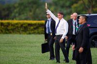 Brazil's President Jair Bolsonaro gestures to supporters, at the Alvorada Palace, in Brasilia, Brazil, December 12, 2022. REUTERS/Adriano Machado